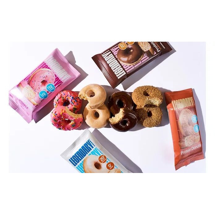 Assorted Legendary Protein Donuts and packs flying, chocolate, pink sprinkle and cinnamon flavors
