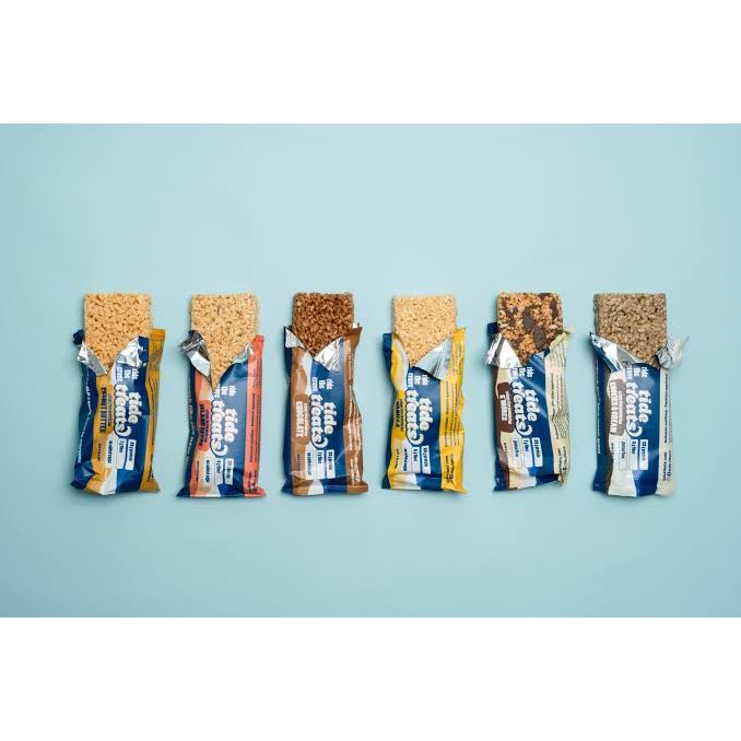 Tide Treats crispy rice protein bars — six unwrapped flavors lined up