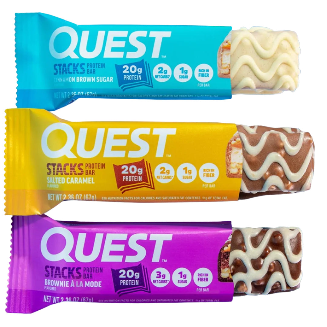 Quest Nutrition Stacks protein bars standing half-unwrapped on a blue background showing layered texture