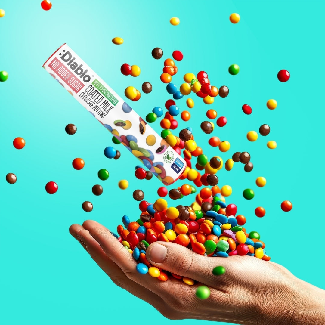 Diablo No Added Sugar Coated Milk Chocolate Buttons 22g tube pouring colourful buttons into a hand