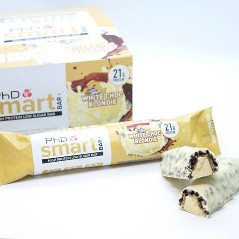 PhD Smart White Choc Blondie protein bar box with unwrapped bars showing cookie pieces inside