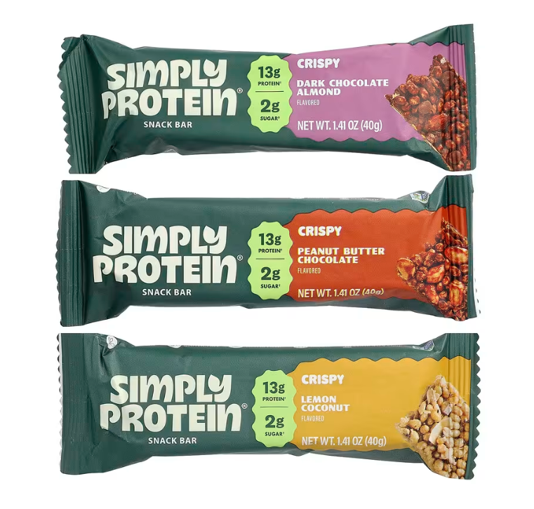 SimplyProtein Vegan Protein Bars — Dark Chocolate Almond, Peanut Butter Chocolate and Lemon Coconut bars stacked