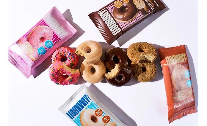 Assorted Legendary Protein Donuts and packs flying, chocolate, pink sprinkle and cinnamon flavors