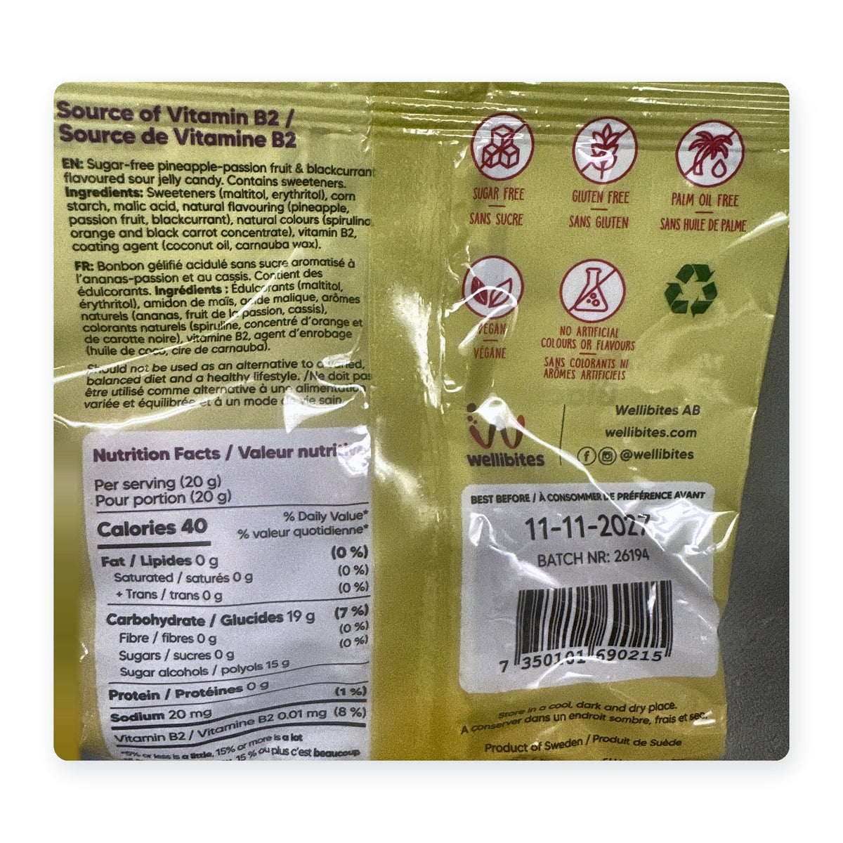 Back of the Wellibites Pineapple-Passion Blackcurrant 70 g bag showing nutrition facts, ingredients and sugar-free, gluten-free, vegan icons